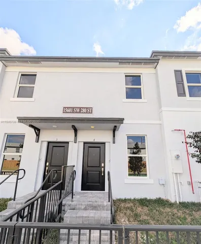 a view of a house with wooden deck
