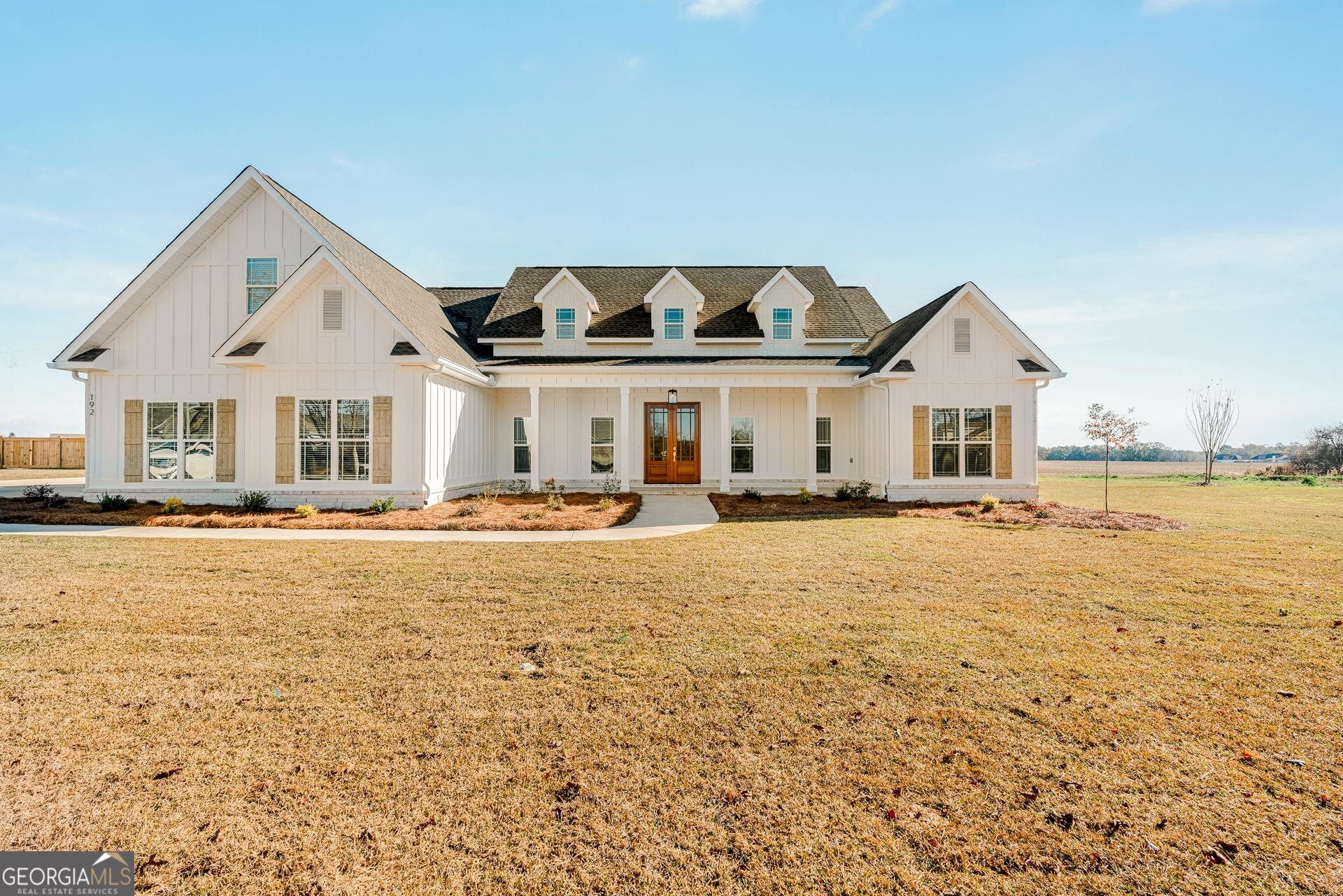 a house with swimming pool in front of it