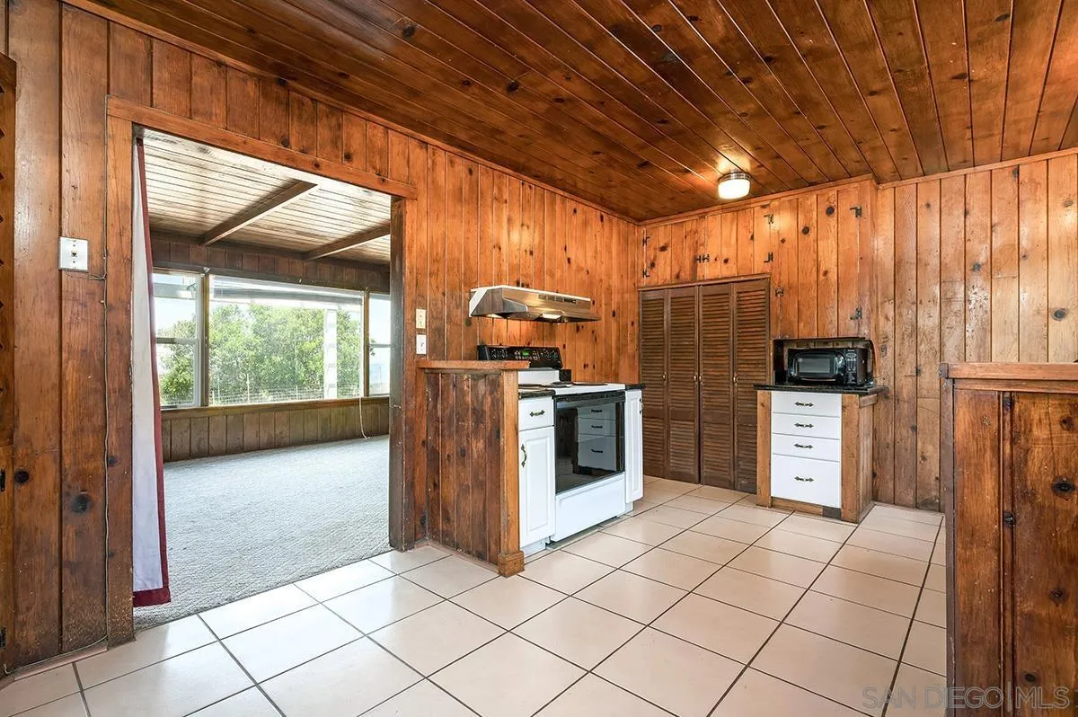 515 Anderson Road Alpine, CA 91901 - Photo 8 of 25 a open kitchen with stainless steel appliances granite countertop a stove a sink and a refrigerator