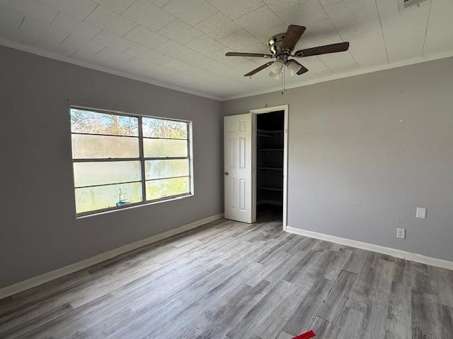 875 Woodrow Street Silsbee, TX 77656 - Photo 9 of 10 wooden floor in an empty room with a window