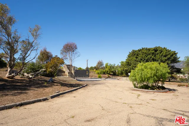a view of a bench in front of a house