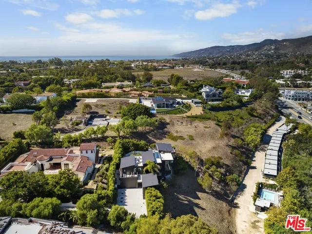 a kitchen with a white cabinets and white appliances