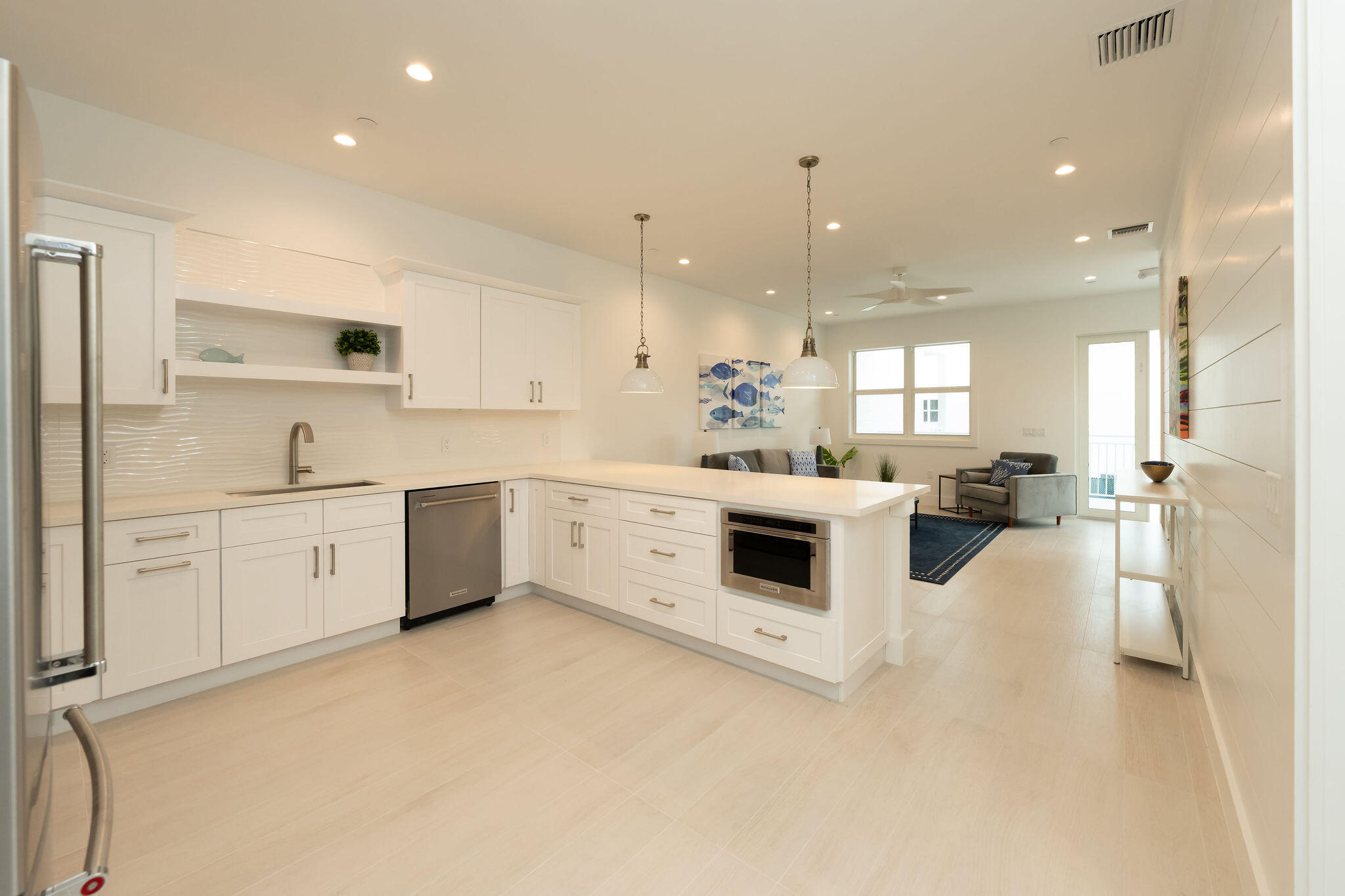 a kitchen with white cabinets and white appliances