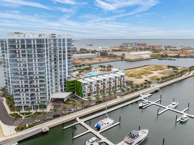 a picture of city view with two chairs and a table