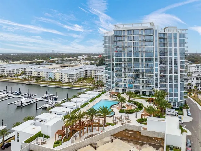 an aerial view of a house with balcony and residential kitchen
