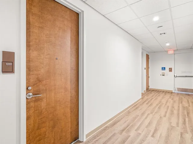 a kitchen with counter top space and windows