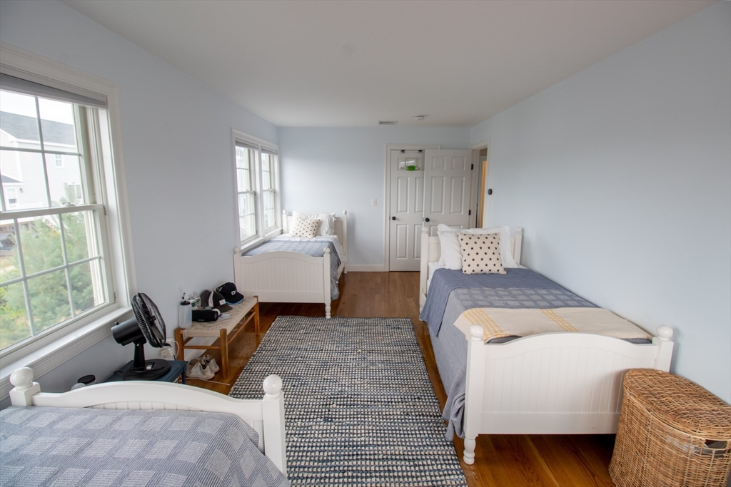 117 River Street Scituate, MA 02050 - Photo 12 of 23 a bedroom with a bed and wooden floor
