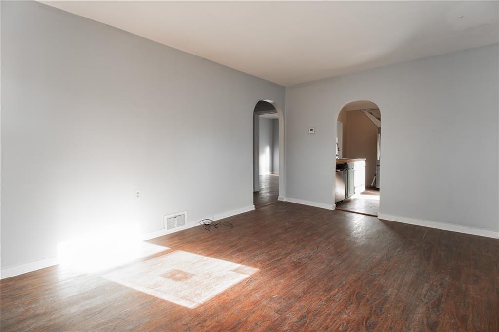 4 Quarry Road Sewickley, PA 15143 - Photo 3 of 19 an empty room with wooden floor and mirror
