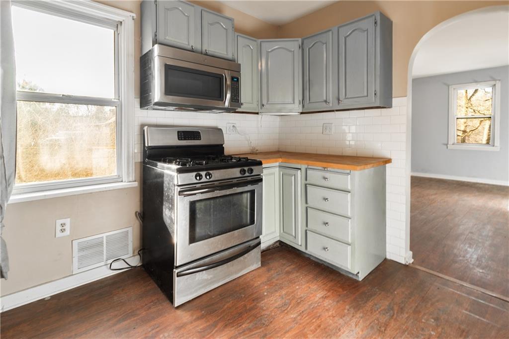 4 Quarry Road Sewickley, PA 15143 - Photo 5 of 19 a kitchen with white cabinets appliances and a window