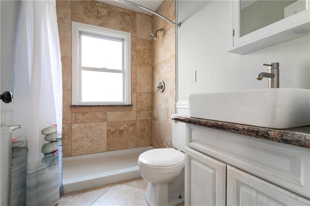 4 Quarry Road Sewickley, PA 15143 - Photo 9 of 19 a bathroom with a sink a toilet and shower