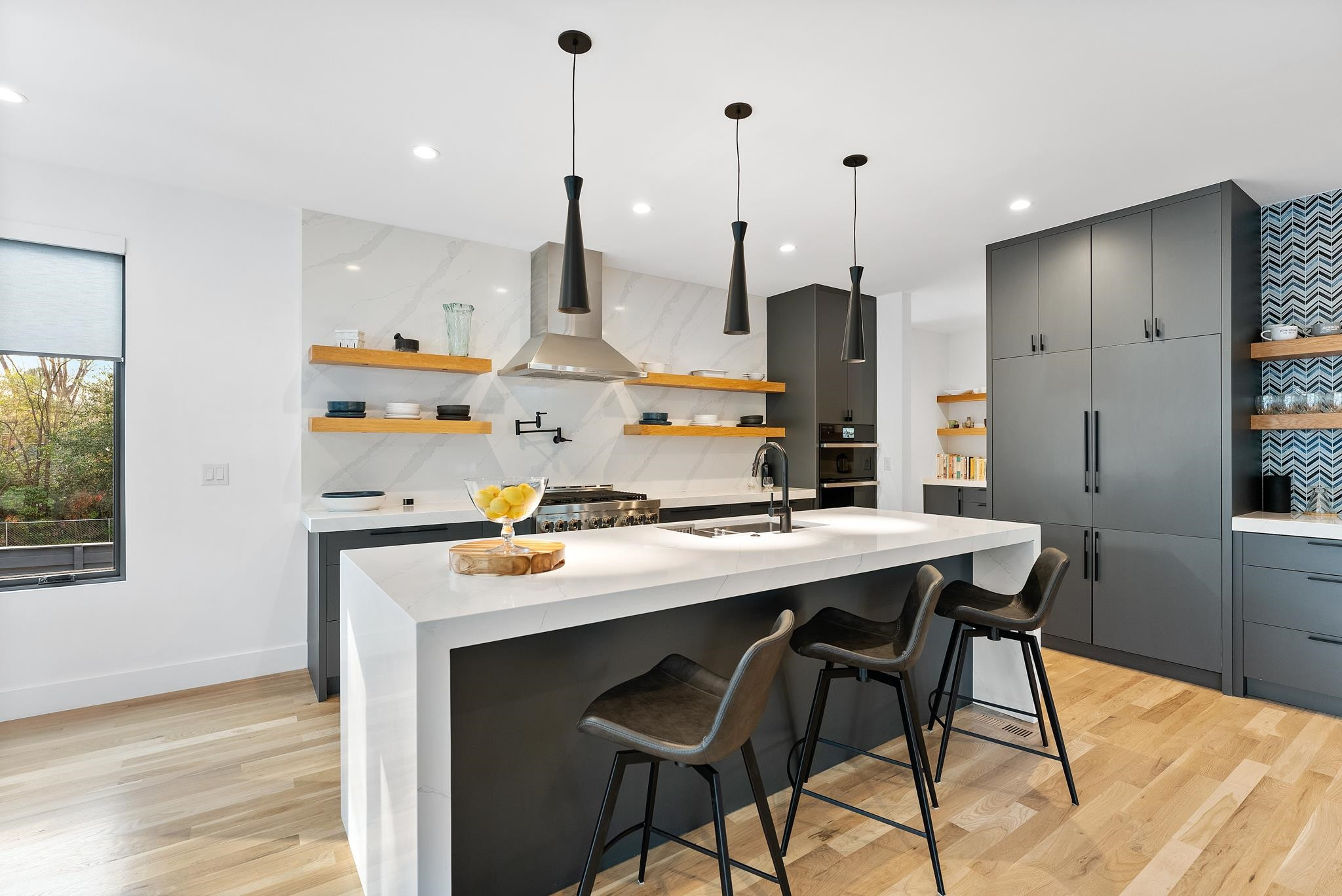 2511 Stafford Avenue Raleigh, NC 27607 - Photo 18 of 74 Quartz, high end design/ appliances, 6 burner gas range, built in ovens, pot filler, and so much more Gourmet kitchen with dual waterfall island