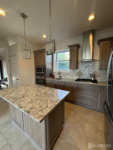 a bathroom with a sink toilet and a mirror