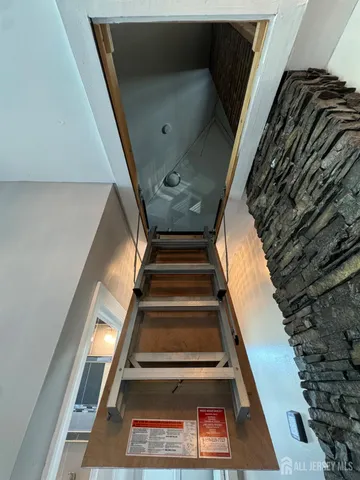 a view of a balcony with wooden floor