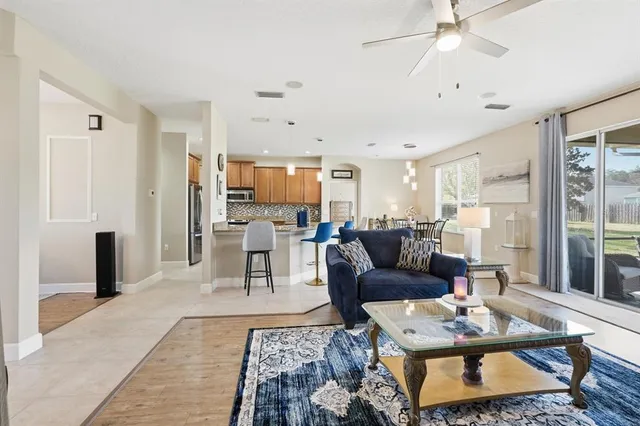 a living room with furniture and a table