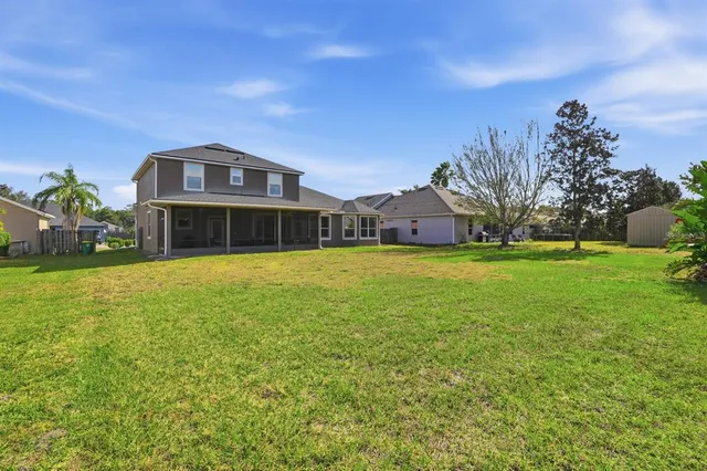 an aerial view of a houses with outdoor space