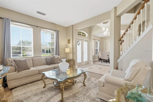 a living room with furniture and a large window