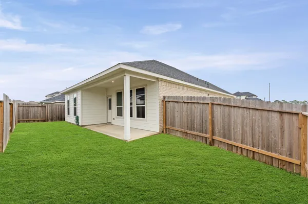 a front view of a house with a yard and porch