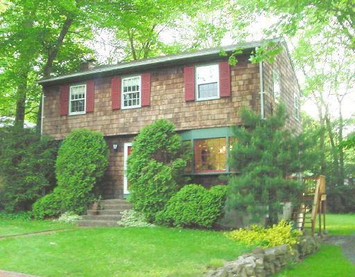 104 West Lake Road Trumbull, CT 06611 - Photo 1 of 1 a front view of a house with a yard