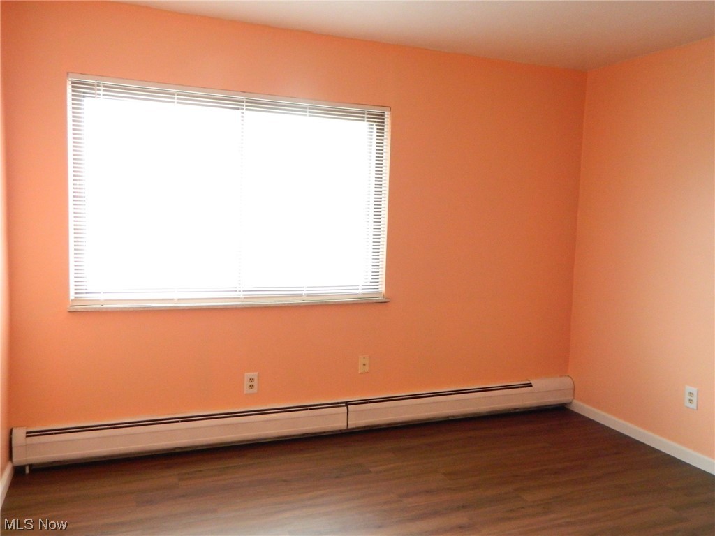 10744 Valley View Road, Unit B8 Northfield, OH 44067 - Photo 9 of 15 Freshly painted and good-sized bedroom. Blinds on the window.