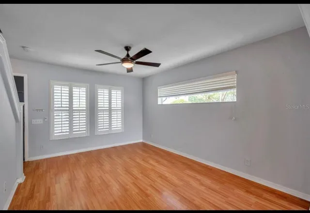 a view of an empty room with a window