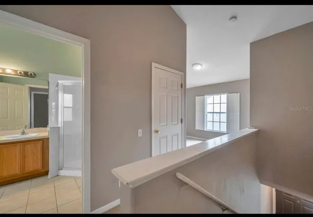 a view of an empty room and window