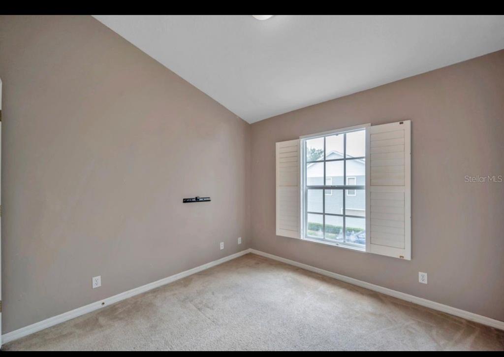 13059 Thoroughbred Loop Largo, FL 33773 - Photo 20 of 32 a view of an empty room with a window