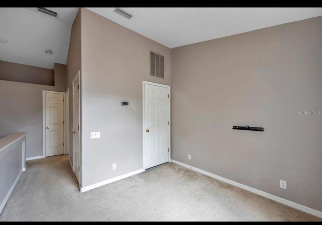 13059 Thoroughbred Loop Largo, FL 33773 - Photo 21 of 32 a view of an empty room