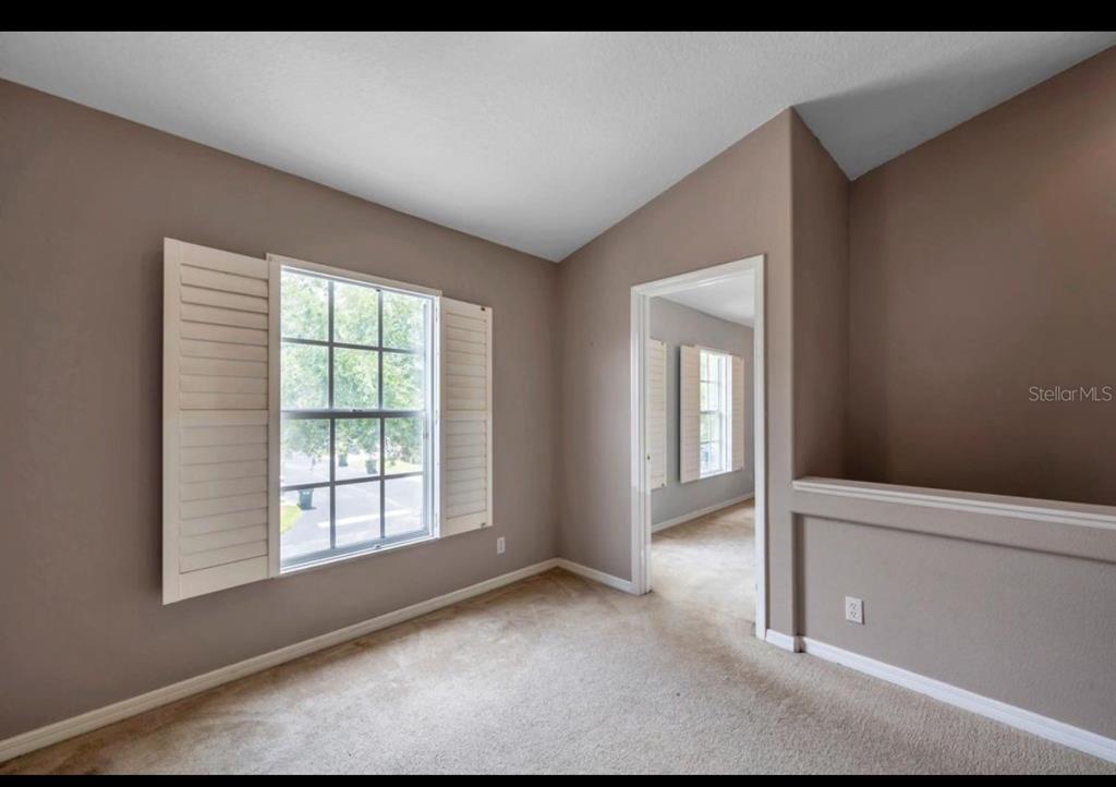 13059 Thoroughbred Loop Largo, FL 33773 - Photo 22 of 32 a view of an empty room with a window