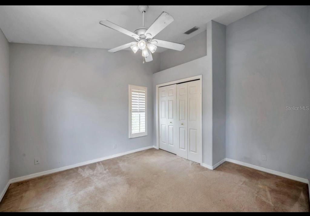 13059 Thoroughbred Loop Largo, FL 33773 - Photo 24 of 32 a view of an empty room with a window