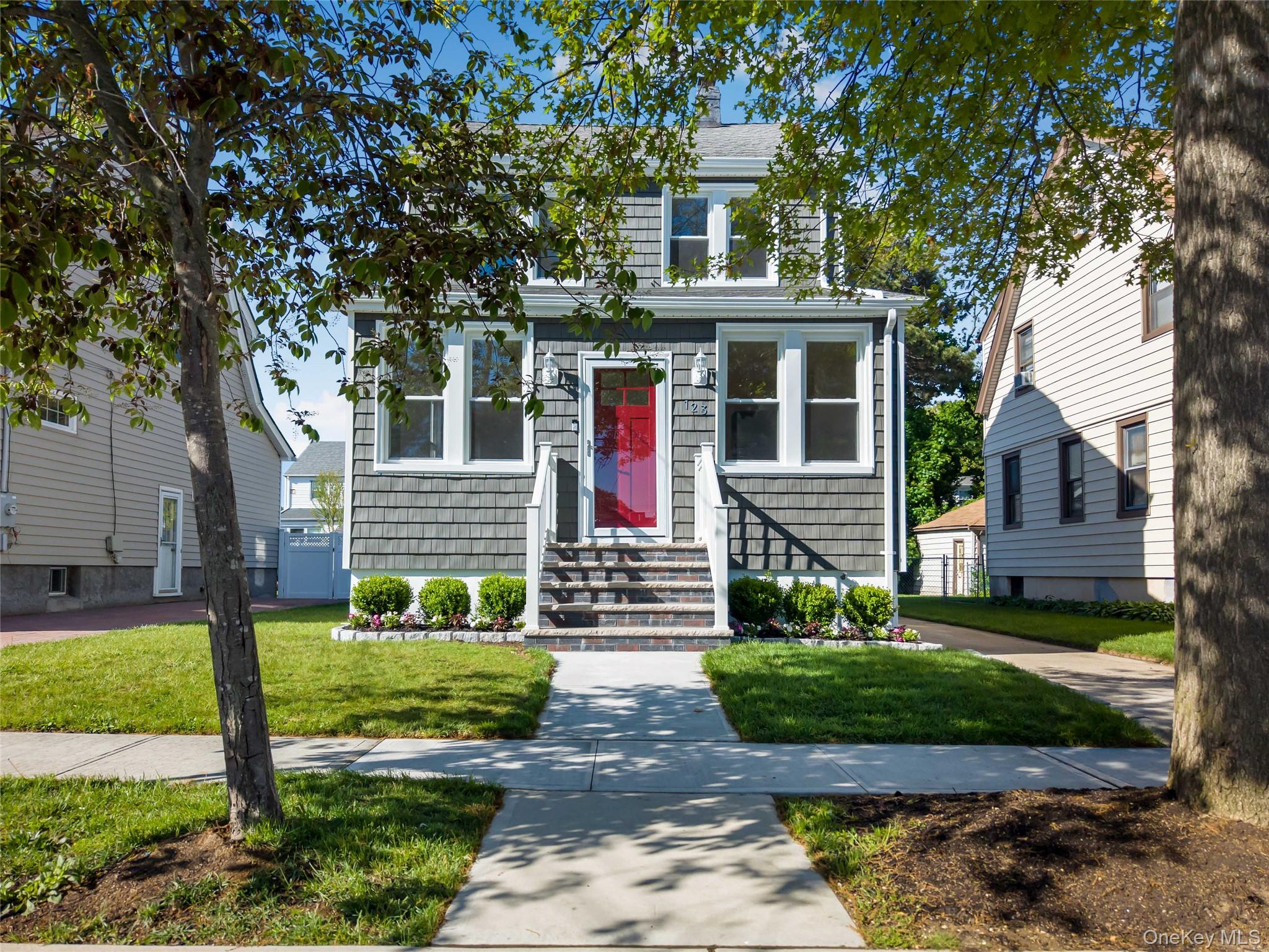 123 East Maple Street Valley Stream, NY 11580 - Photo 1 of 11 a front view of a house with a yard