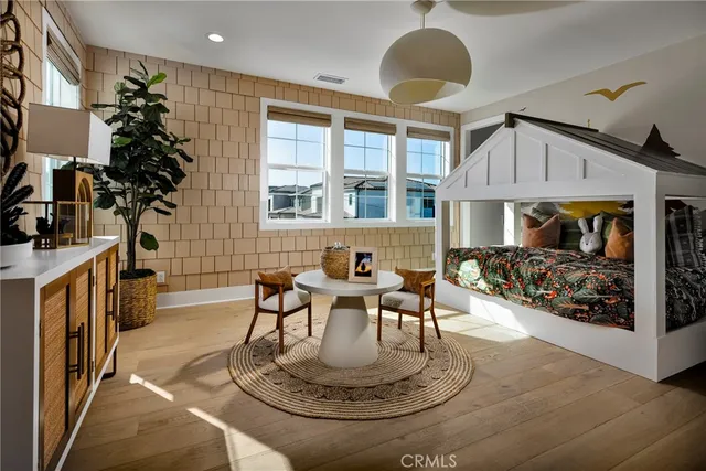a dining room with furniture a rug and a chandelier