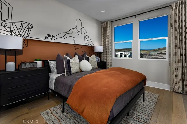 a bedroom with bed and window