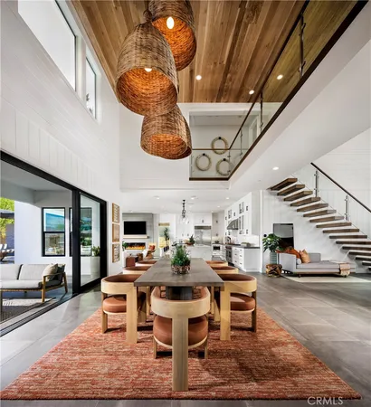 a living room with lots of furniture and a chandelier
