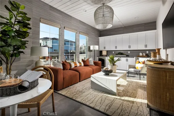 a living room with furniture and a chandelier