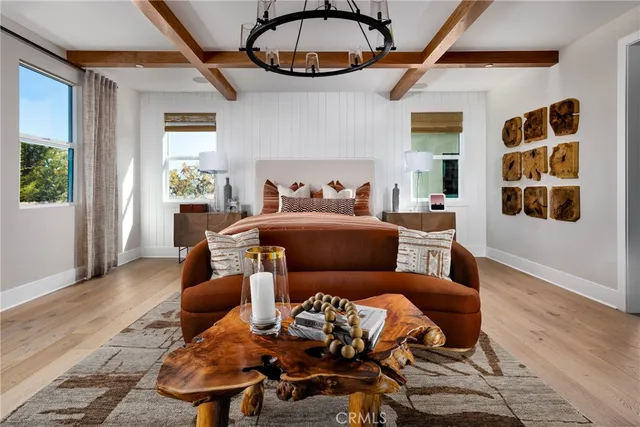a living room with furniture a rug and a window