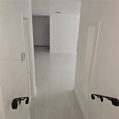 wooden floor and cabinet in an empty room