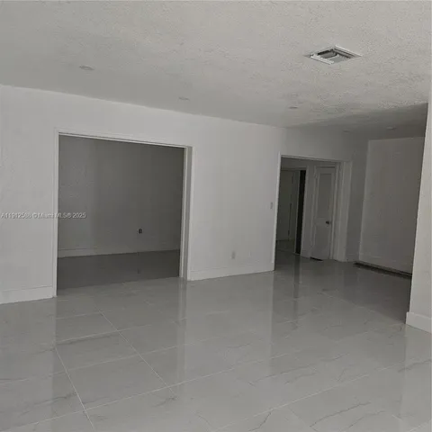 a view of a room that has a window in it