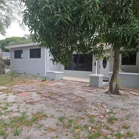 a car parked in front of a house