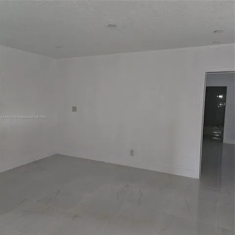 an empty room with an empty room