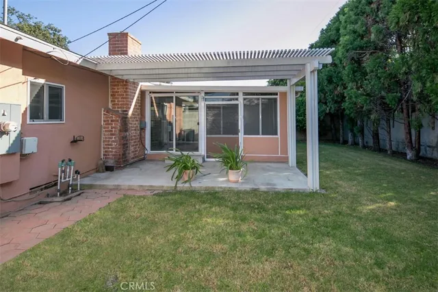 a front view of a house with a garden and porch