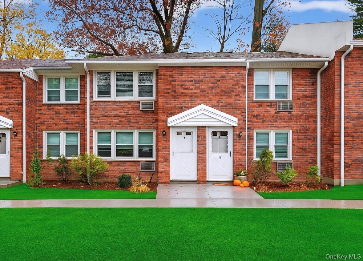 2710 South Road, Unit B5 Poughkeepsie, NY 12601 - Photo 1 of 19 a front view of a house with a yard and garage