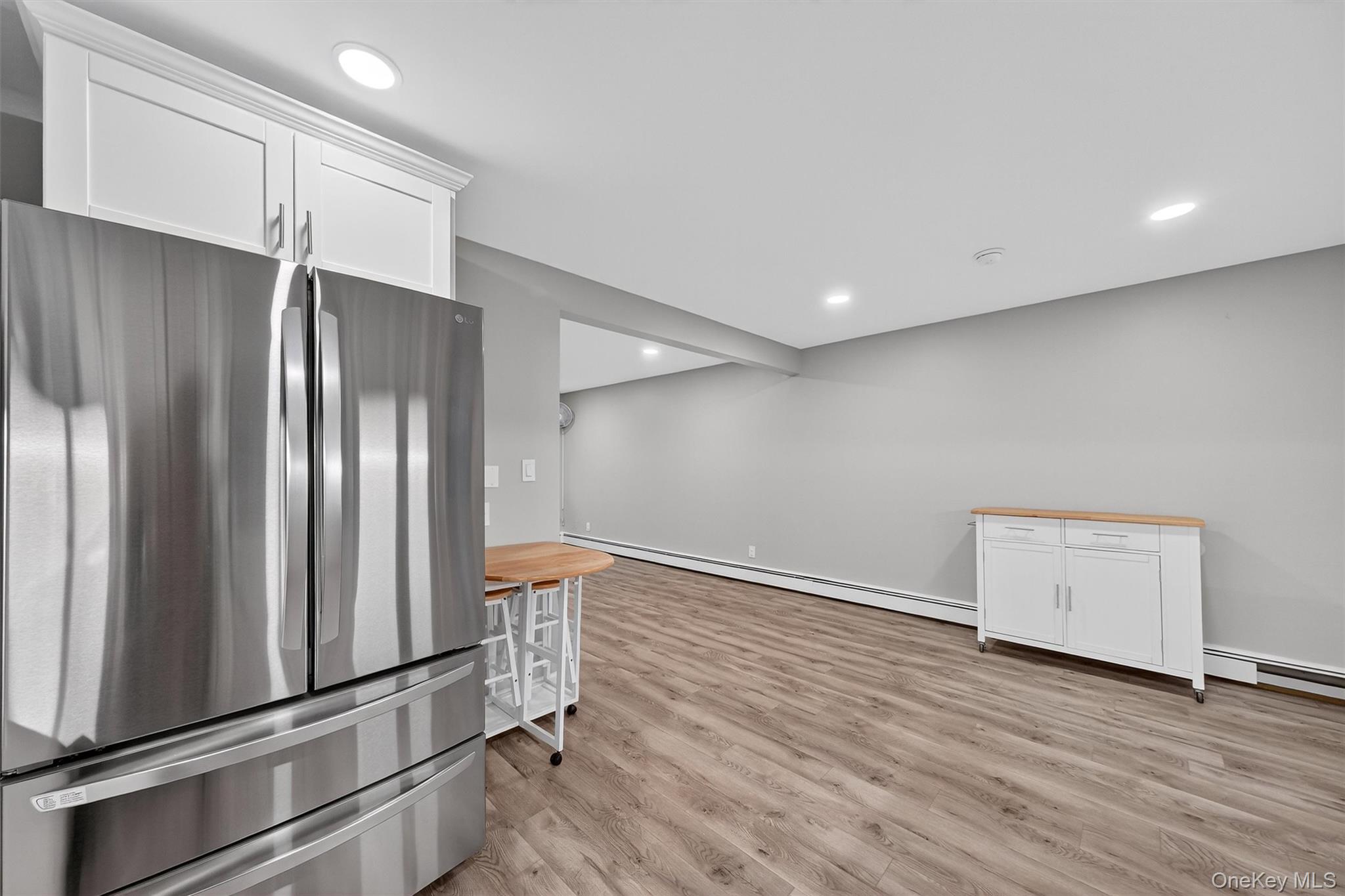 2710 South Road, Unit B5 Poughkeepsie, NY 12601 - Photo 11 of 19 a view of an empty room with wooden floor and a window