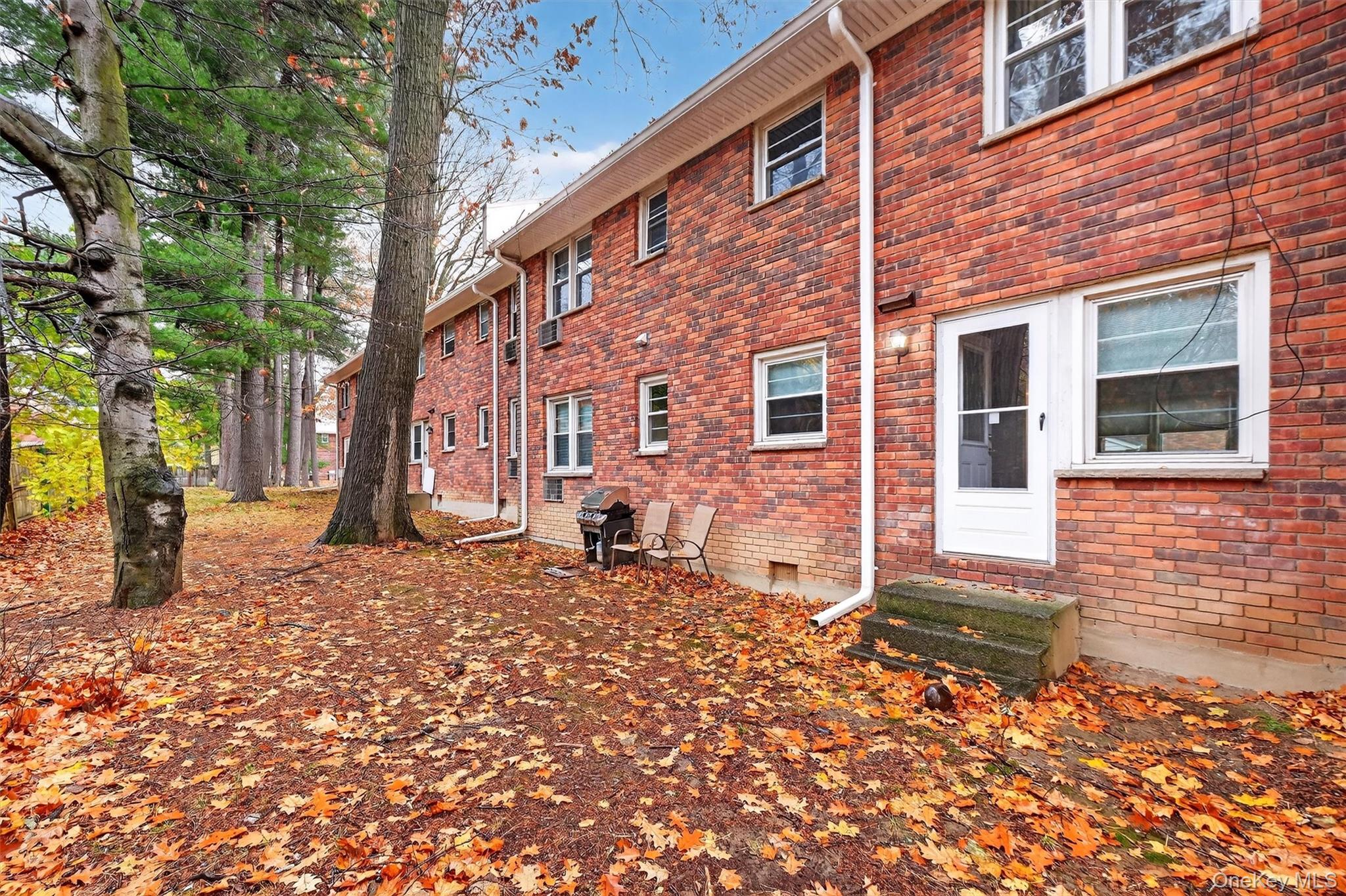 2710 South Road, Unit B5 Poughkeepsie, NY 12601 - Photo 19 of 19 a backyard of a house with seating space