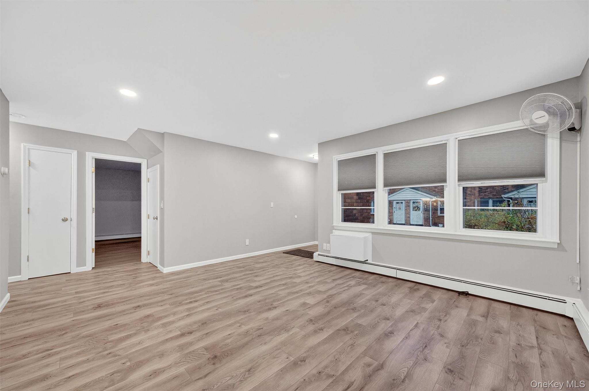 2710 South Road, Unit B5 Poughkeepsie, NY 12601 - Photo 4 of 19 wooden floor in an empty room with a window
