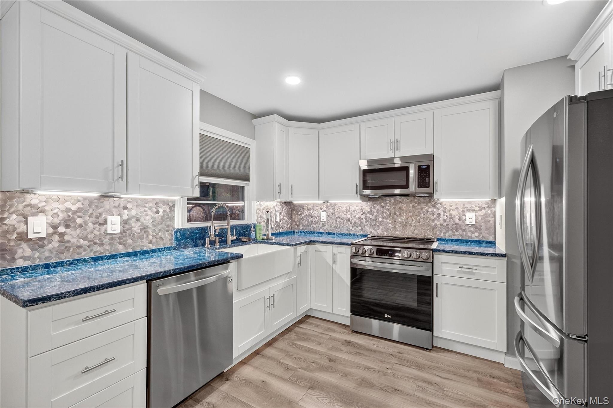 2710 South Road, Unit B5 Poughkeepsie, NY 12601 - Photo 9 of 19 a kitchen with stainless steel appliances granite countertop a stove a sink and a refrigerator