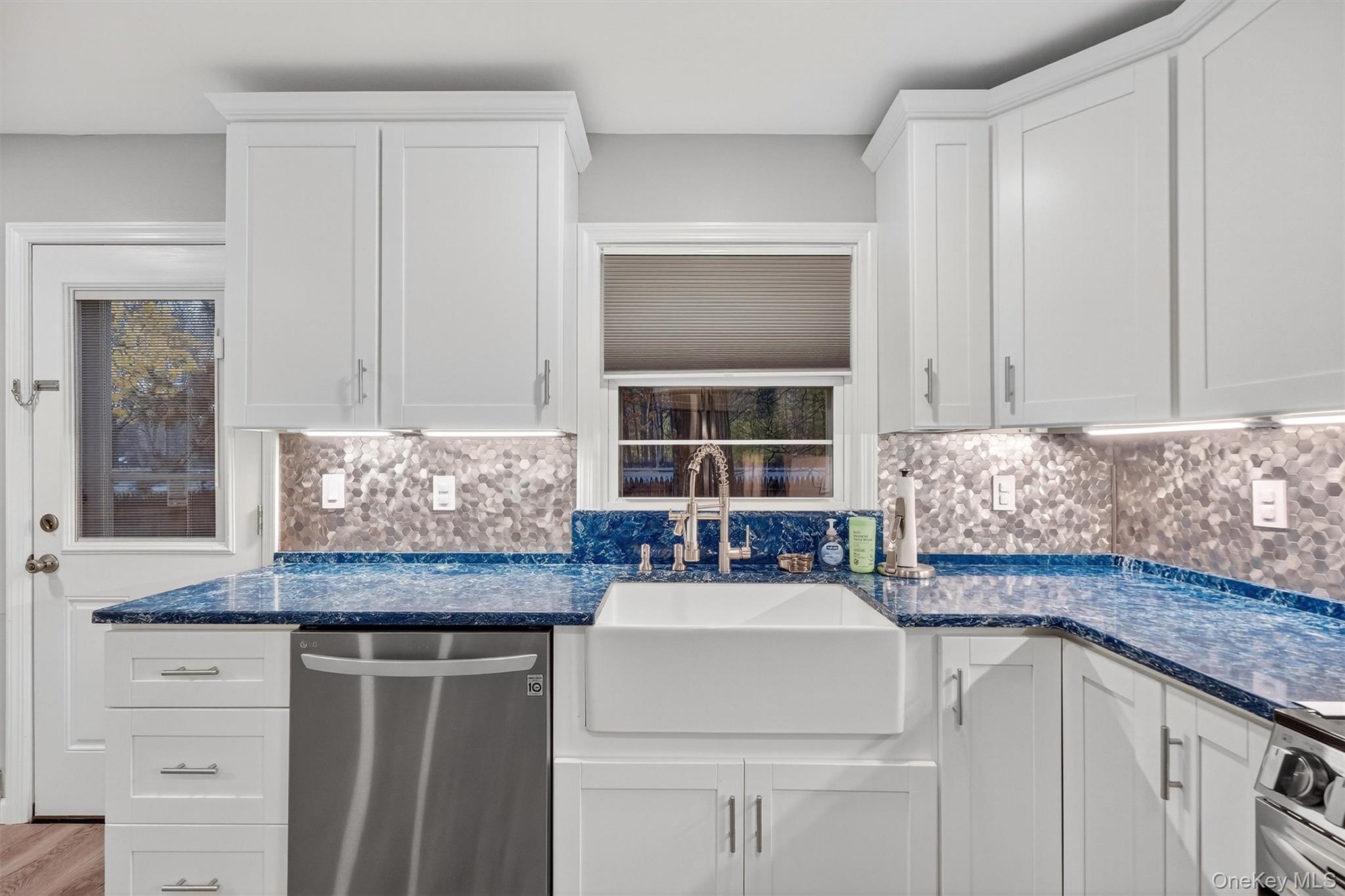 2710 South Road, Unit B5 Poughkeepsie, NY 12601 - Photo 10 of 19 a kitchen with granite countertop a sink and a window