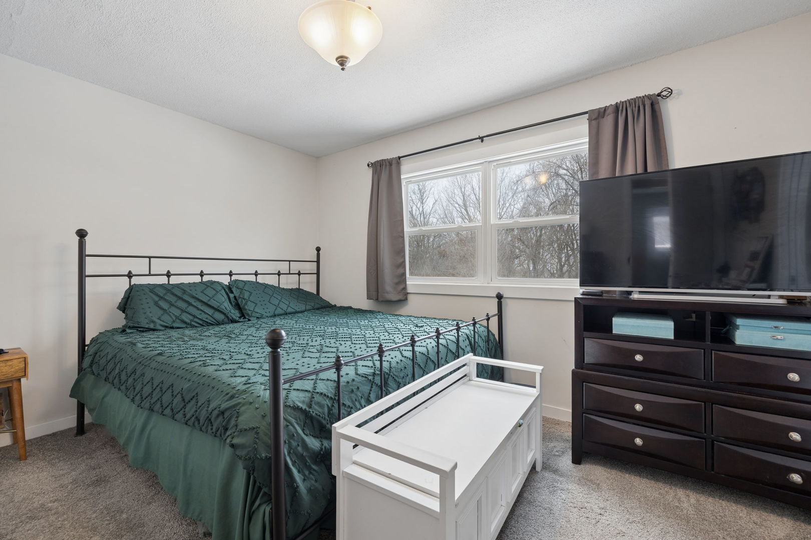 24254 South Burr Road Channahon, IL 60410 - Photo 9 of 22 a bedroom with a bed and a flat screen tv