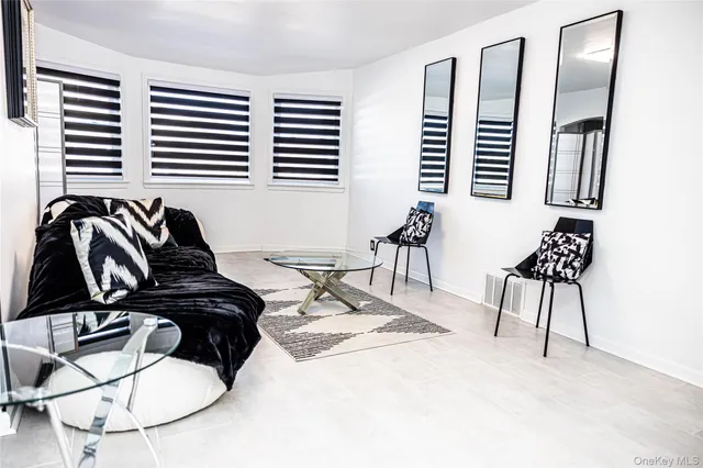 a view of a livingroom with furniture and lounge chair