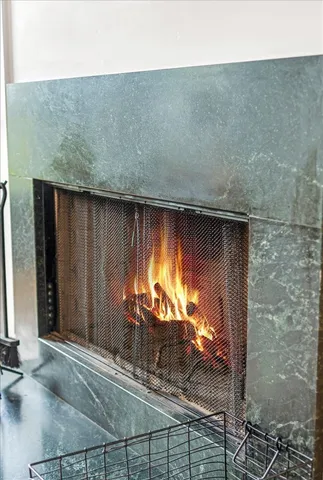 a kitchen with granite countertop a sink stove and refrigerator