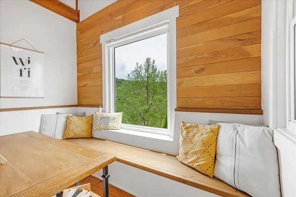 a en suite bathroom with a granite countertop sink and a mirror